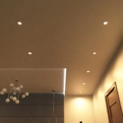 Pack Of 50 6w, Colour Adjustable Fire Rated Downlights, Brushed Chrome -LED Downlights Store full shot of a ceiling with mounted warm white brushed chrome downlights 2