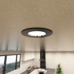 Pack Of 25 Matt Black GU10 Fire Rated Downlights -LED Downlights Store mid shot of a mounted black led downlight 1